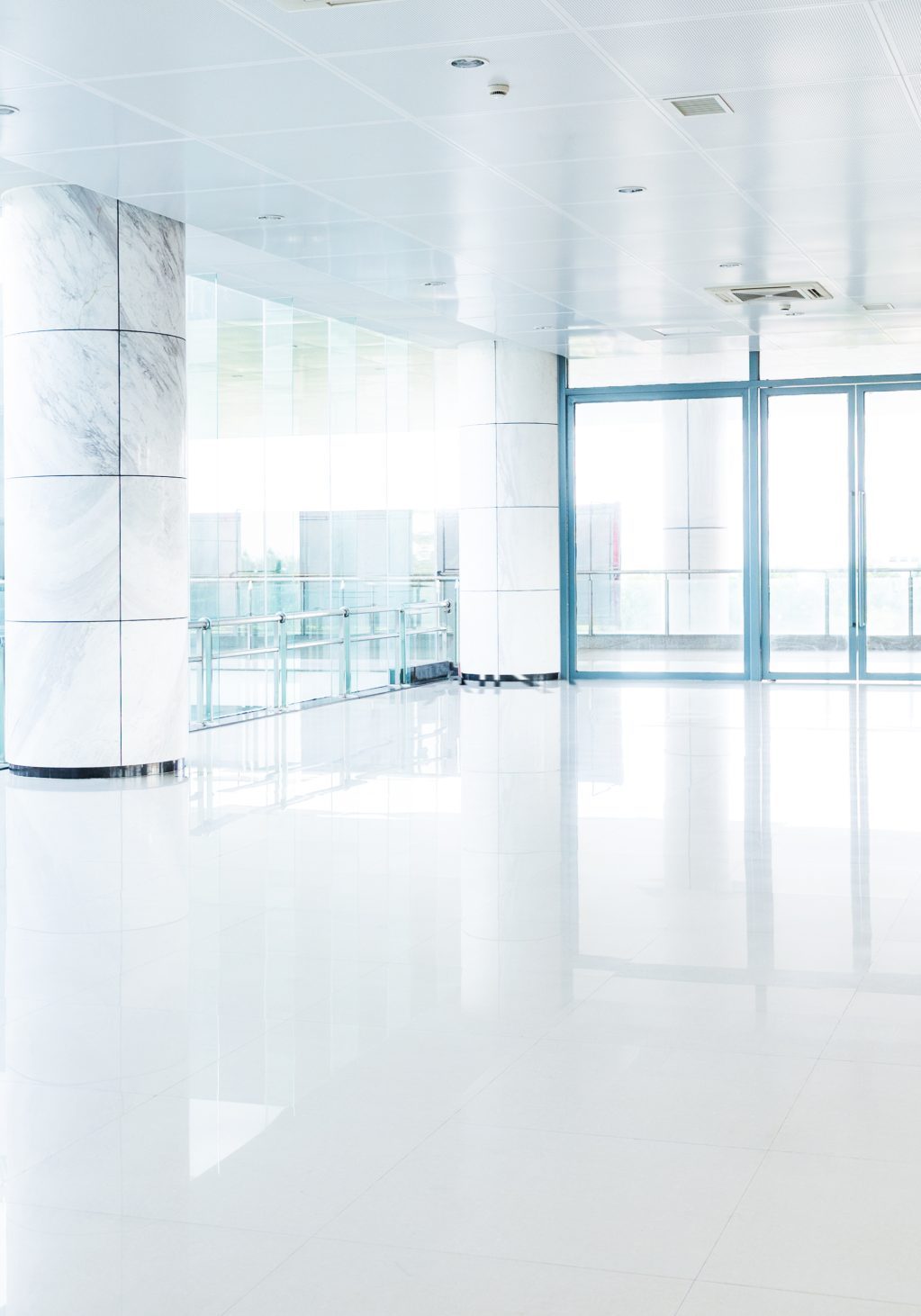 Empty long corridor in modern office building.
